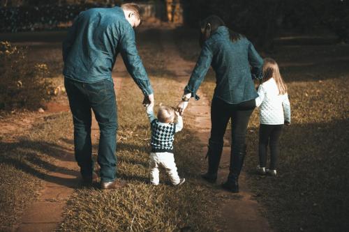 family walking together holding hands